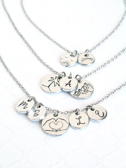 Silver necklaces with various pendants on a white background